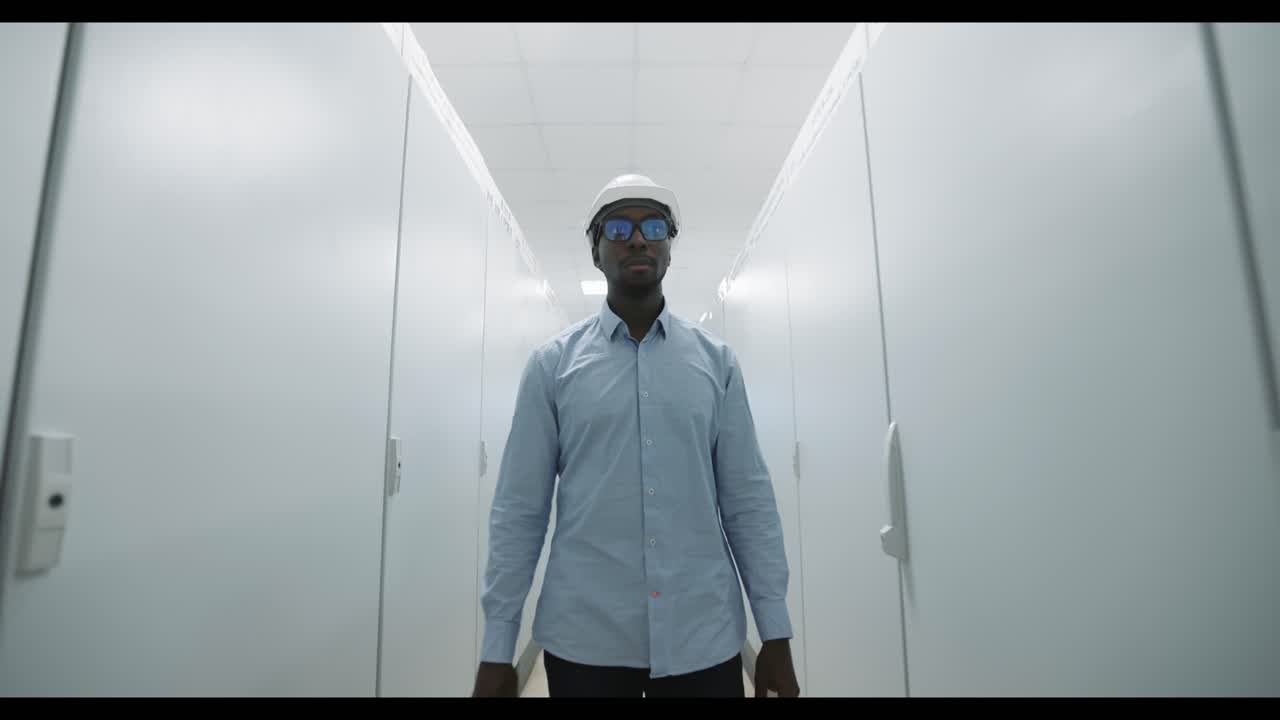 Engineer Walking Through a Corridor