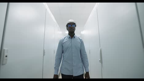 engineer walking through a corridor