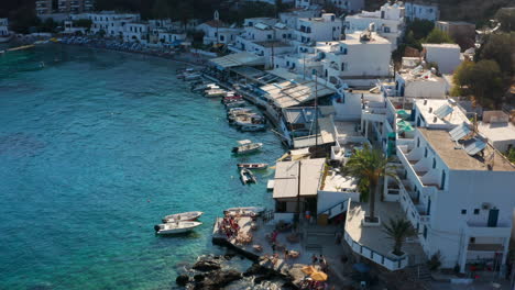 beautiful white architecture and pristine waters in loutro in the island of crete, greece - aerial shot