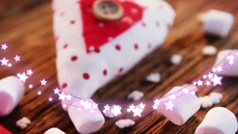 Animation-of-string-lights,-marshmallows-and-christmas-decorations