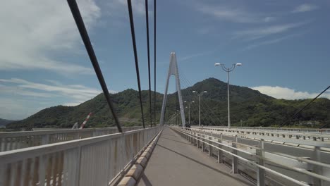 Riding-bike-along-Shimanami-Kaido,-Crossing-Bridge-Point-of-View-Shot