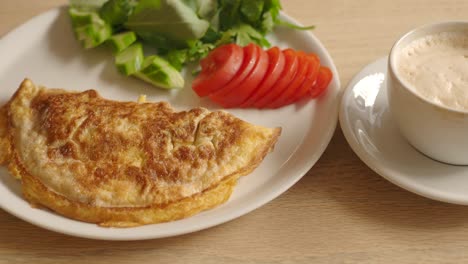 breakfast omelette with salad and coffee