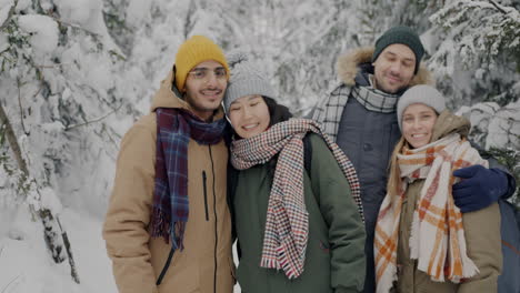 friends enjoying a snowy day in the forest