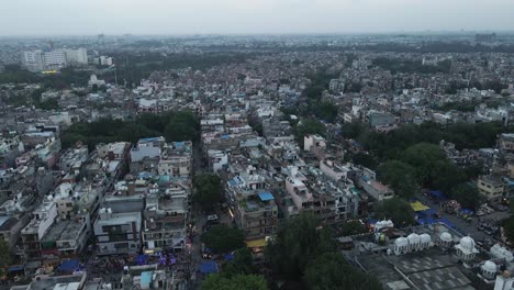 4K-Aerial-Shots-of-Local-Market-in-New-Delhi-Residential-Suburbs-on-a-beautiful-day-gliding-over-Rooftops,-streets,-parks-and-markets-in-India