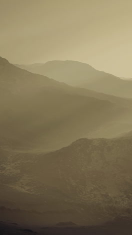 serene mountain landscape enveloped in mist at dawn during early morning hours