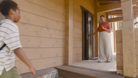 angry mother saying to her son to get in the house