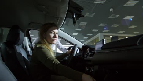 salesman pitching car to female client