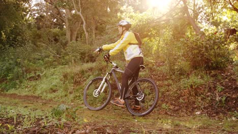 mountain biking couple pointing at nature