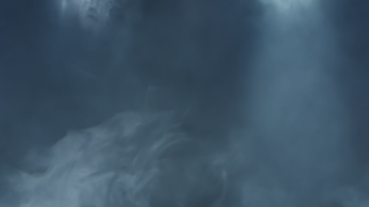 L'atmosfera cinematografica di fumo illuminato da luce stroboscopica bianca