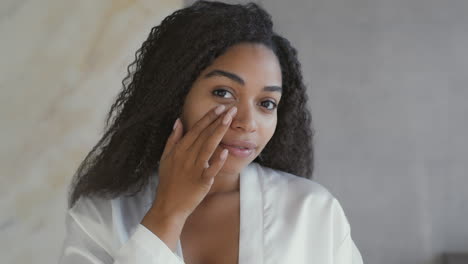 woman applying skin care