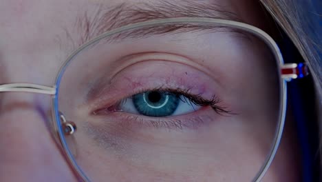 close-up of a woman's eye wearing glasses