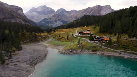 turquoise lake oeschinensee  in kandersteg, bern, in the alps of switzerland. aerial view of mountains