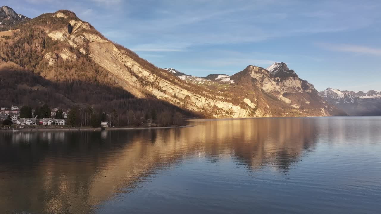 Walensee, Switzerland stunning aerial view, breathtaking mountain reflections, crystal-clear waters and charming alpine villages.