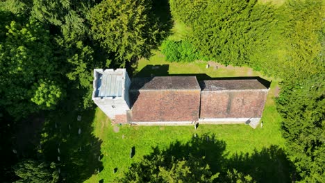 a high-angle pan of lady magdalene church in denton, encircled by trees