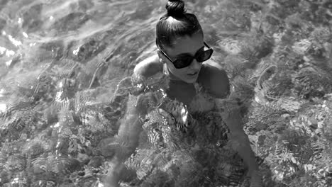 woman swimming in shallow water