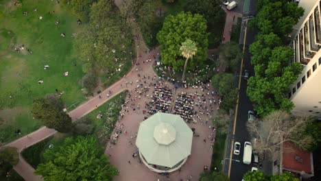 aerial top down shot of people watching show in la glorieta de belgrano in buenos aires