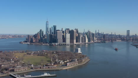 an aerial view of new york harbor on a sunny day with blue skies