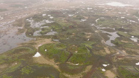 Aerial-landscape-view-of-Raudholar-craters,-the-Red-Hills,-geological-formations-of-volcanic-rocks,-in-Iceland