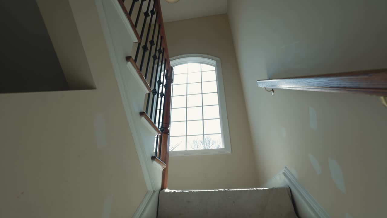 Rays of sunlight illuminate a freshly renovated stairwell