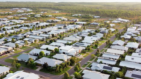 Aerial-drone-shot-of-large-modern-home-in-a-new-suburban-street