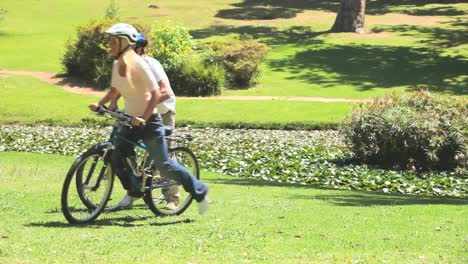 Young-man-and-his-wife-cycling