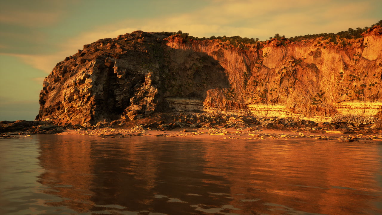 Peaceful bay reflecting warm evening light and rocky formations