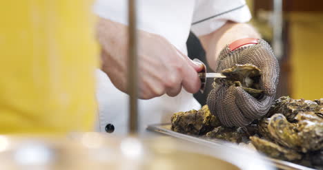 chef preparing oysters dish in elegant restaurant 2