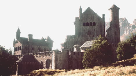 a crumbling stone castle in a scenic landscape