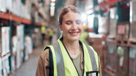 a woman wearing a safety vest in a warehouse