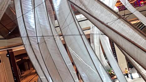 pov shot at the lobby of solaire resort north going up on an escalator