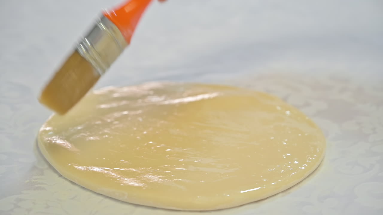 Cook lubricates the dough for placints with oil, Romanian and Moldovan traditional food. Slow motion