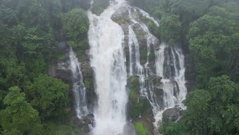 aerial view cascading wachirathan waterfalls. dolly back