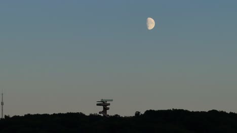 Above-Dutch-landmark,-Wilhemina-Tower,-Moonlit-sky-and-tranquil-scenery