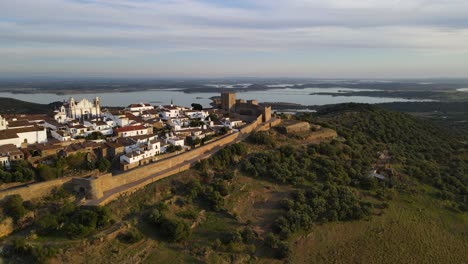 monsaraz village on hilltop at sunset, portugal