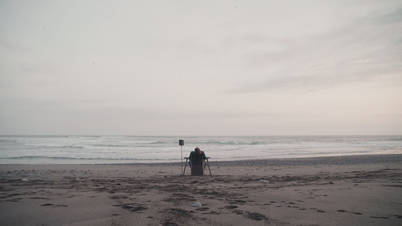 Man Resting At Coastline