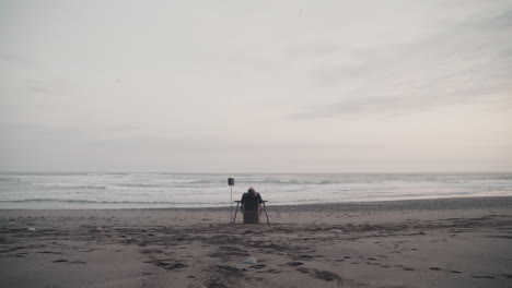 man resting at coastline