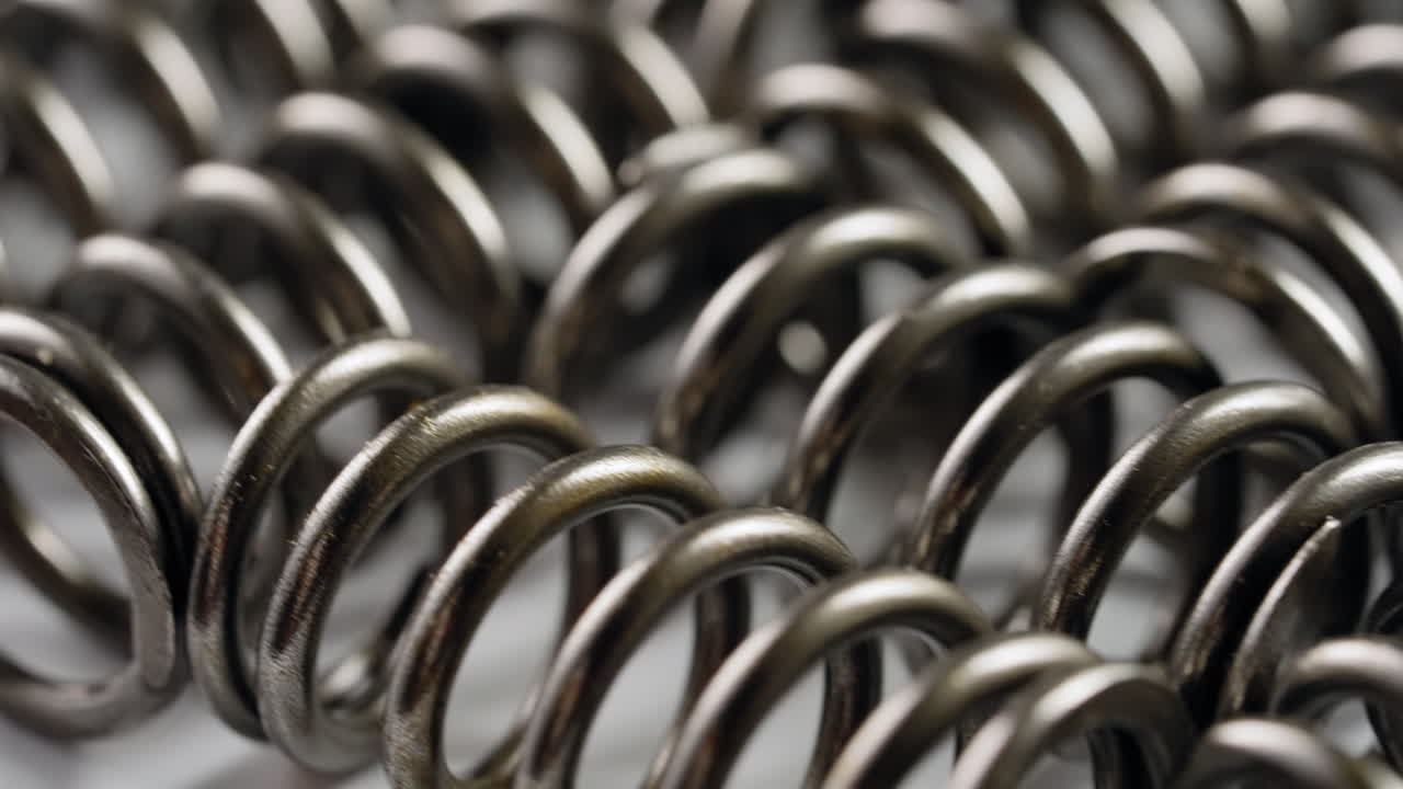 detailed close-up of thick metal springs in coil formation | freepik