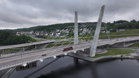 vehicles driving over farris bridge crossing the farris lake, north of larvik, norway