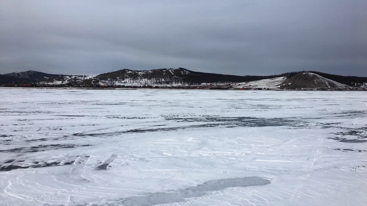 Snow-Covered Frozen Lake Khovsgol, Mongolia On An Overcast Winter Day