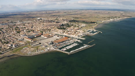 port de tabarka fishing harbor aerial drone shot sunny day etang de thau