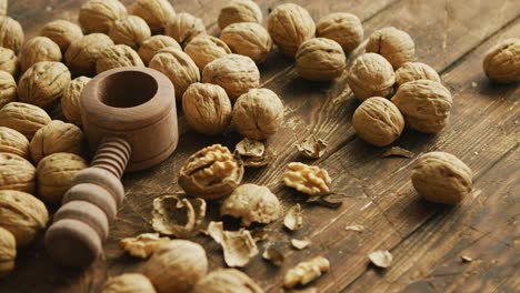 Walnuts and nutcracker on table