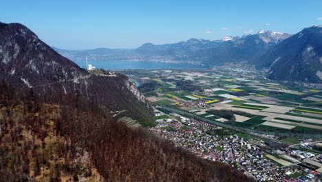 Drone-fly-above-the-Vionnaz-and-Torgon-and-revealing-the-lake-Léman,-Montreux-and-Vevey,-in-Switzerland