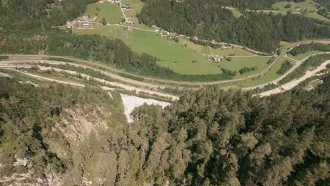 Action-camera-footage-from-FPV-racing-drone-flying-fast-and-very-close-down-a-canyon-in-Austria-in-summer