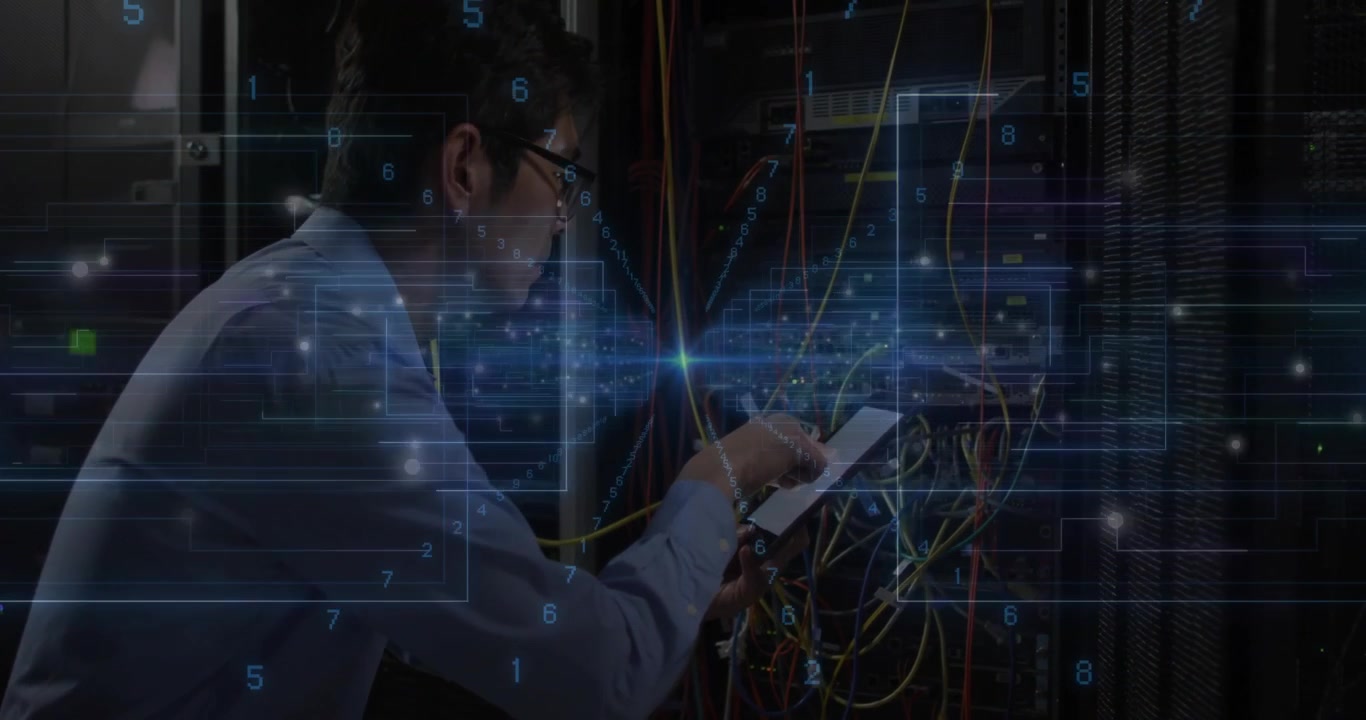 Network engineer handling tablet while managing cables, showing glowing data overlay graphics