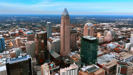 group of high-rise brick buildings in chicago downtown. skyscrapers are seen at backdrop. aerial view