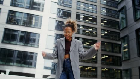 stylish woman dancing in the city