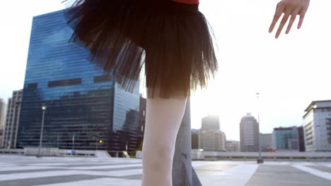 Ballet-dancer-stretching-on-pavement-4k