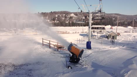 circling a snowmaker as a blasts a cloud of fresh artificial snow across the field