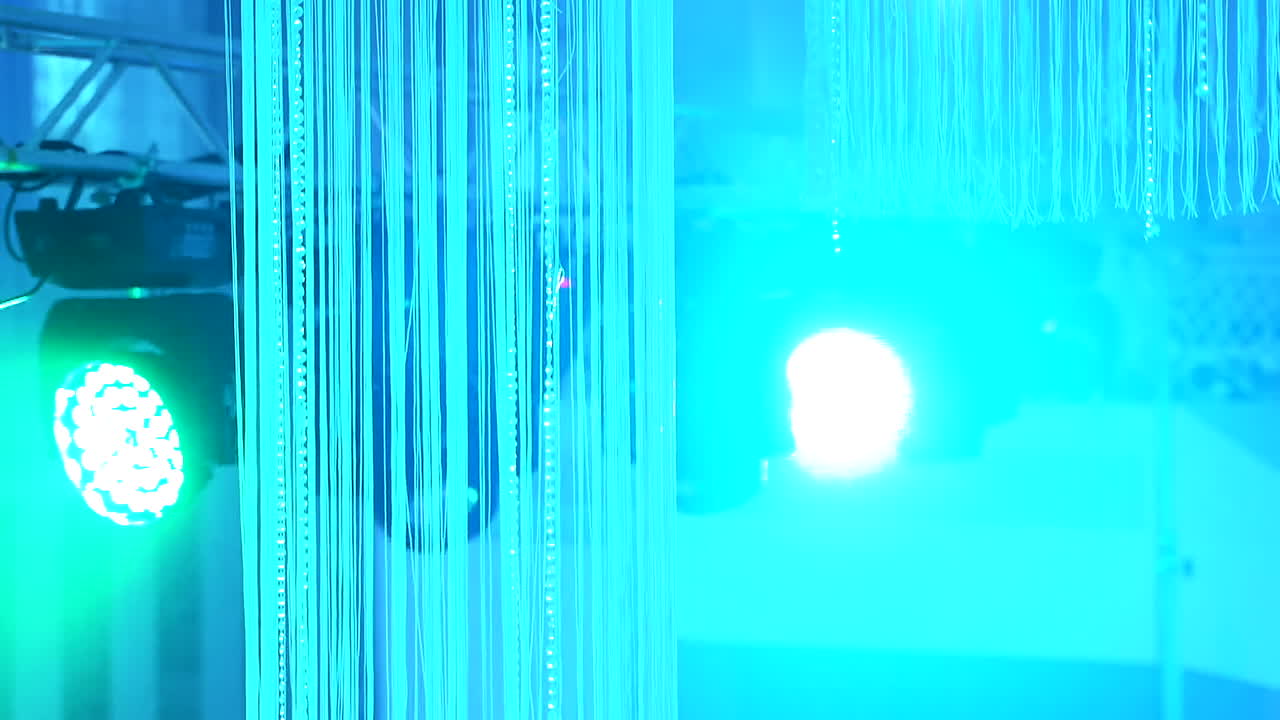 Colorful lights at concert stage. Spotlights and illumination equipment on stage background