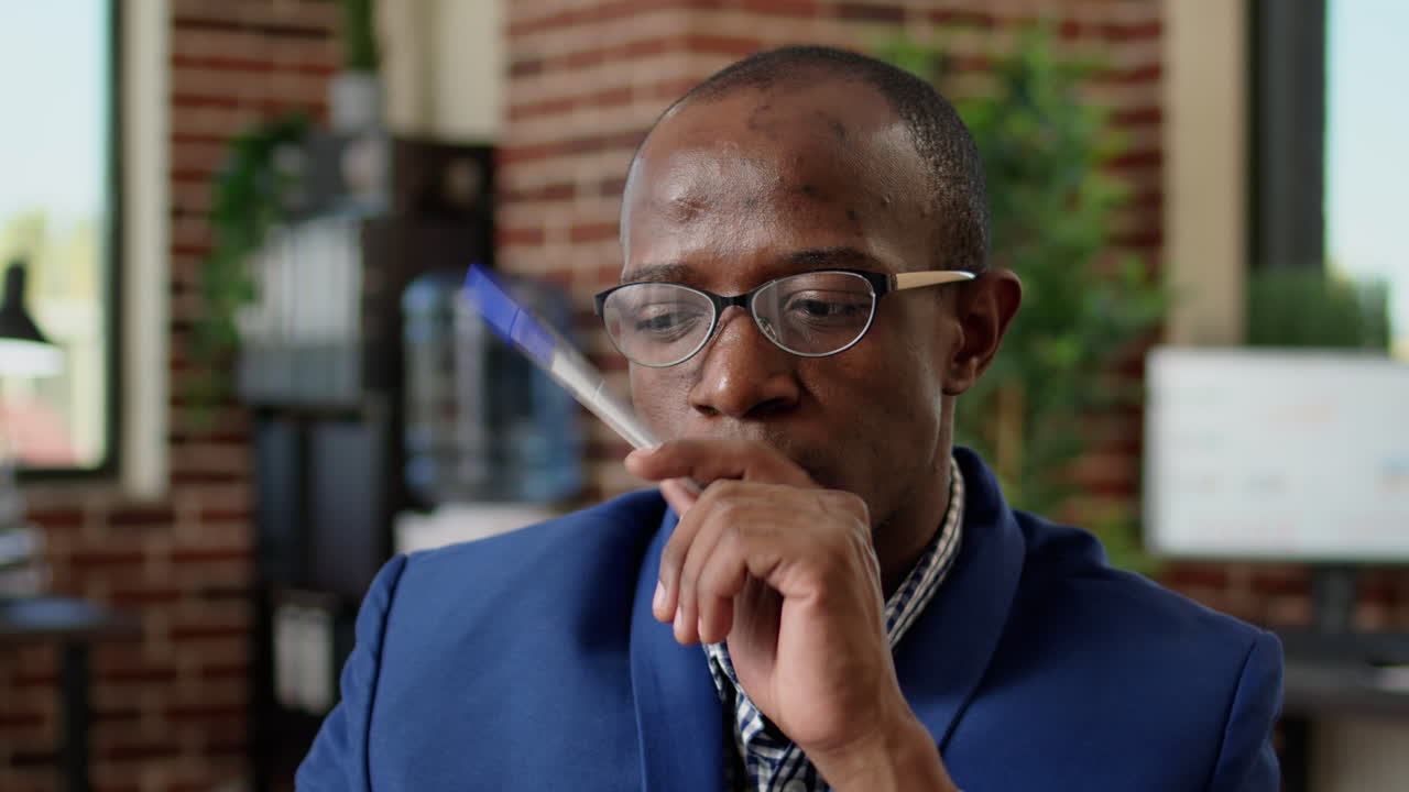 Pensive employee brainstorming new ideas for business research